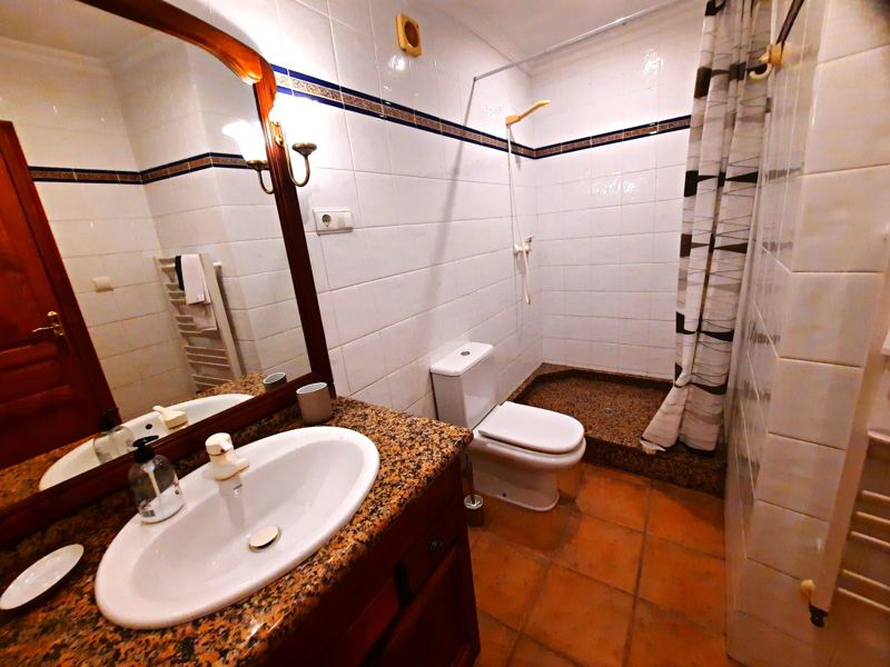 Bathroom with marble washstand and shower