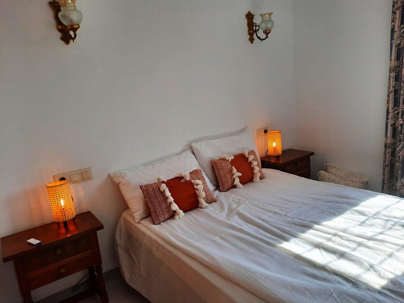 Bright bedroom with white linen