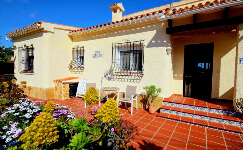Front of the villa with flowering garden